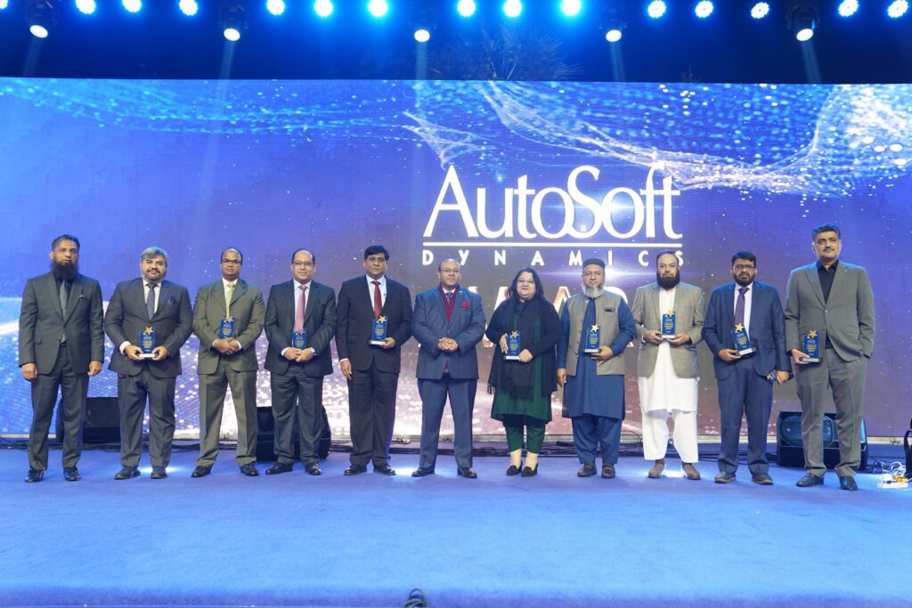 AutoSoft Dynamics colleagues on stage receiving tenure awards